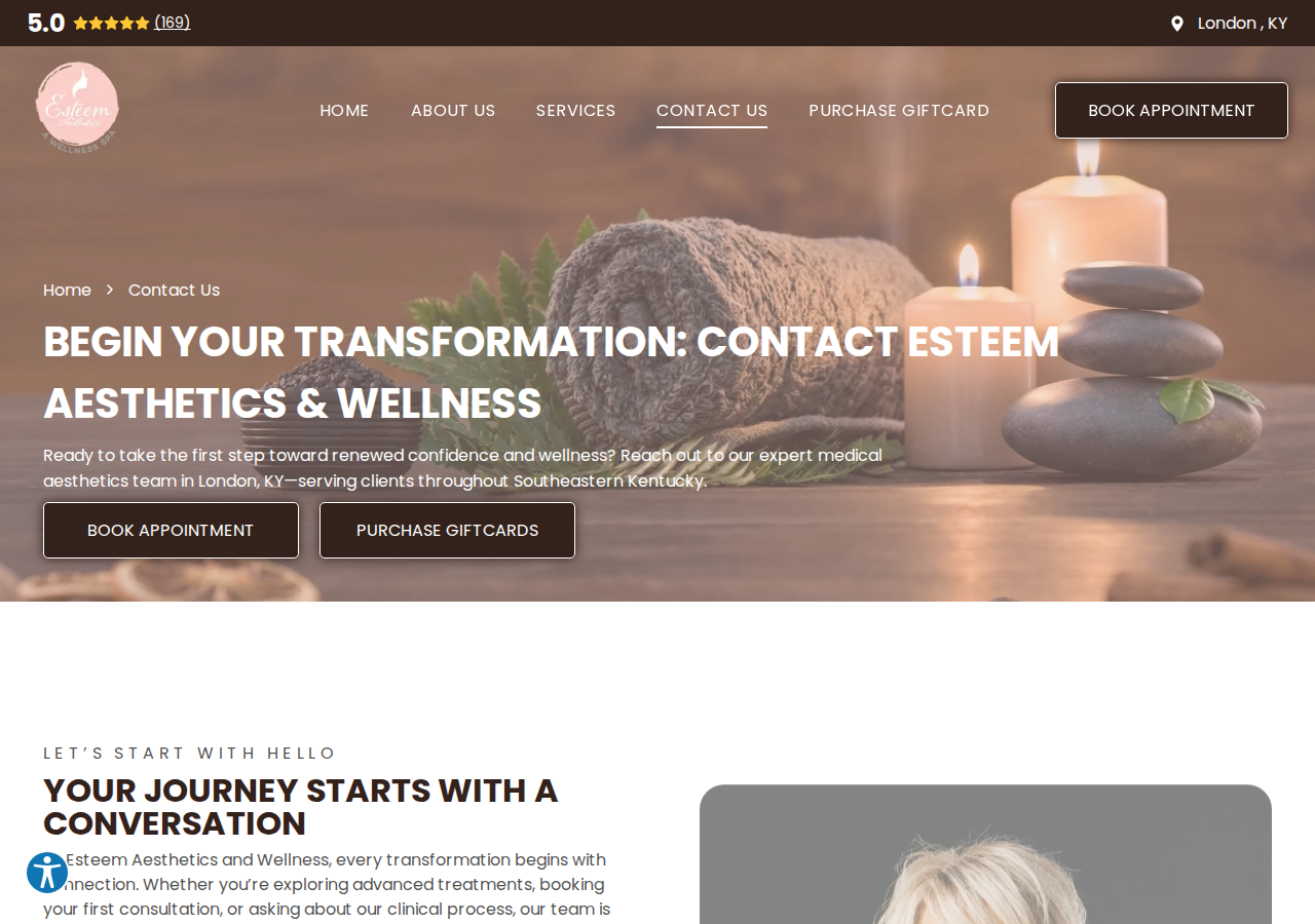 Screenshot of Contact Us | Esteem Aesthetics, A Wellness Spa | KY
A dark, blurred background with a vibrant, glowing golden abstract light pattern sweeping across the center.Hamburger menu iconBlack icon of a telephone handset with three curved sound waves emanating from the top, indicating a call in progress.A black icon of a classic telephone handset.A black envelope icon representing email or messaging.A black map pin icon used to represent a specific location on a map.A black circular clock icon with a white clock face and hands pointing to approximately seven o'clock.